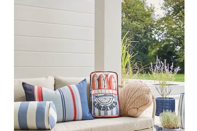 7. Florence Rope Garden Conversation Set, £549 (includes 2 x Single Sofas, 1 x Double Sofa, 1 x Coffee Table); Sardines Outdoor Cushion, £12; Retro Coastal Stripe Outdoor Cushion, £12; Whale Plant Pot, £30, rest of items from a selection, Dunelm