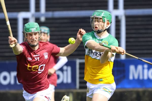 Fiachra Carroll (Offaly) clears ahead of Eoghan Beehan (Westmeath). Picture: Aoife Maher