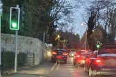 A car mounts the footpath at the narrow junction