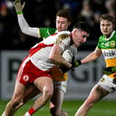 Darragh Flynn and Daire McDaid close down Niall Devlin.