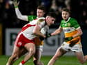Darragh Flynn and Daire McDaid close down Niall Devlin.
