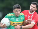 Ruari McNamee is tackled by Mark Abbott. Picture: Ger Rogers