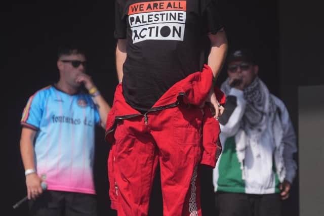 News broadcasts criticising the hip hop trio played from the sound system before they walked onto the stage were booed by the Glastonbury Festival audience.
