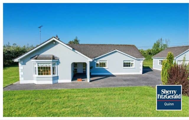 To the rear of the house, there is a large kitchen with polished porcelain tiled floors and built in units. Facing south it is a bright room throughout the day. It is complimented by a utility room with WC. Double doors connect the kitchen to the dining room, which is used as a cosy living room with an open fireplace with a gas fire insert.