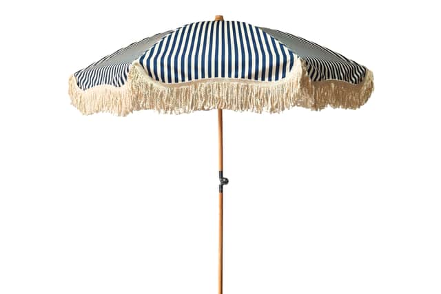 7. Midnight Blue/Ecru Large Tassel Fringed Beach And Garden Parasol, £225, Staycation Vintage Parasols