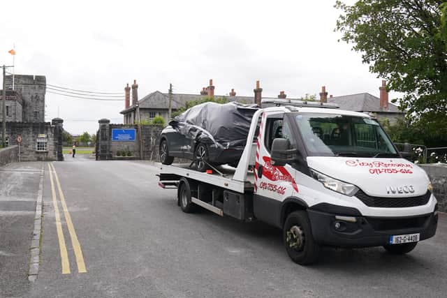 Det Sgt McNulty said the CCTV shows that the boy moving with the car as if he was holding on to it as it drove into the barracks where he continued to stab at the priest before being restrained by the Defence Forces.