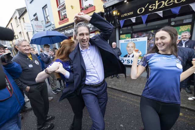 In a video posted on social media, Mr Harris can be seen walking over to Mr Martin and shaking his hand before introducing party candidates.