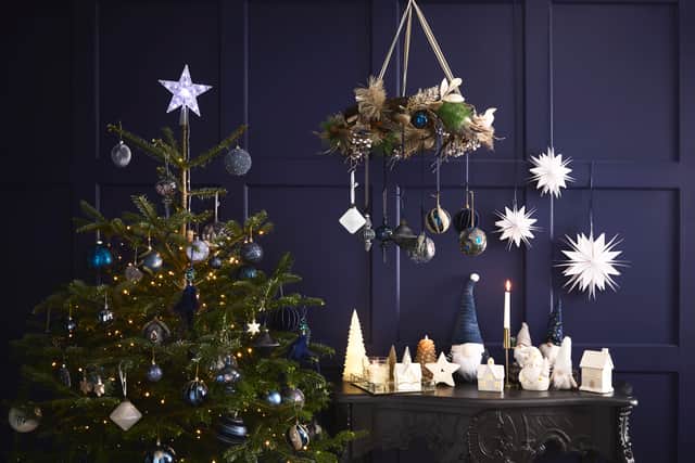 1. Starry Night Light-Up Star Tree Topper, £5, Flocked Navy Bauble, £1.50, Star Swirl Tree Decoration, £2.50, Peacock Feather Jewel Decoration, £2.50, rest of items from a selection, B&M Stores, in-store