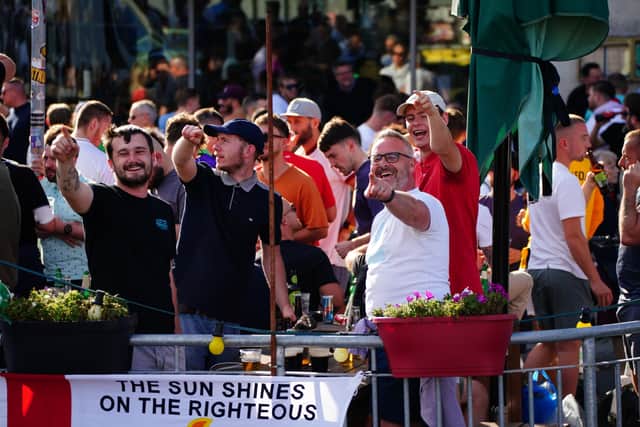 Some England supporters gathered outside Murphy’s Irish Pub on Friedrichstrasse in the city, and sang as German police watched on.