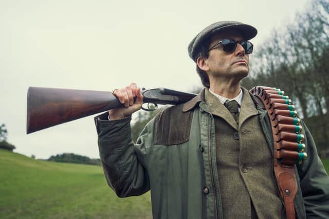 Another clip sees Tennant in a smart suit standing in a doorway with his hand on his hip as Lady Monica Baddingham, played by Sherwood’s Claire Rushbrook, bangs a gong in front of him.