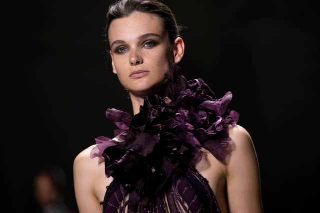 Cloaks, blossoming accessories and floor-length overcoats dominated the runway, following couture week’s trends of exaggerated outerwear and avant-garde layering.