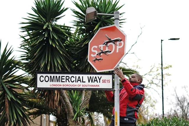 Photos from the scene show a man wearing a red and black jacket using a Lime bike to prop himself up, with one foot placed on the saddle and the other on the handle bars, while the bike is held steady by another man.