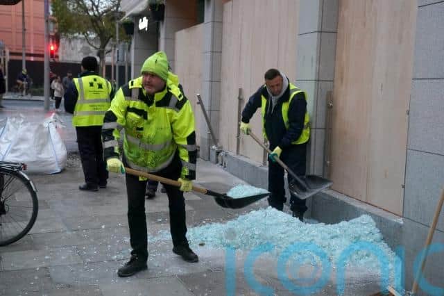 A five-year-old girl injured in the knife attack outside a school remained in a critical condition in hospital on Friday while the female care assistant, in her 30s, was in a serious condition.