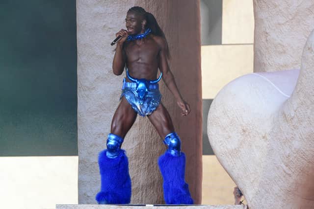 Featuring extravagant costume changes, American rapper and singer Lil Nas X’s set truly stunned fans. One look was a gold plated top and white trousers with furry leg warmers, while his hair was braided back in cornrows and pulled into a kinky Afro textured ponytail.