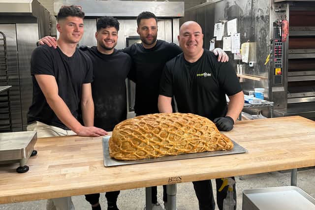 Fellow TikTok chefs Max the Meat Guy, Guga Foods and The Golden Balance lent a helping hand to build the mammoth dish, which consisted of slicing the prosciutto, sou vide cooking the beef until medium rare and encasing it all inside large pastry dough.