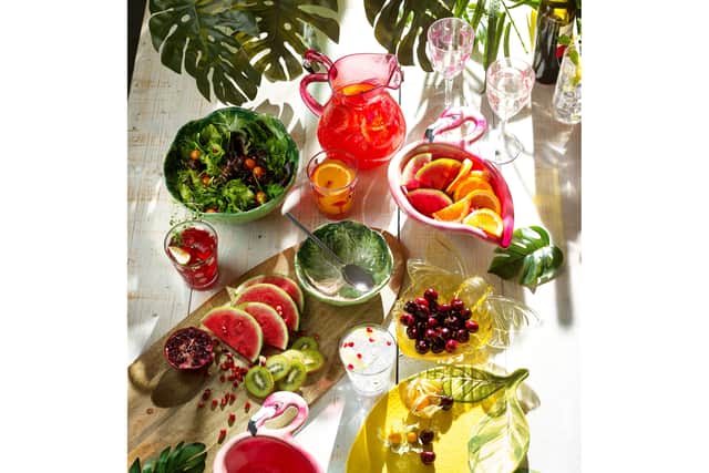 7. Flamingo Plastic Picnicware: Set of 4 Tumbler Glasses, £16; Set of 4 Wine Glasses, £18; Jug, £18; Set of 2 bowls, £18; Yellow Lemon Picnic Serve Platter, £15; rest of items from a selection, Next
