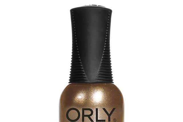 “Start by prepping and filing the nails, before pampering the cuticles ready for polishing. To make this a seamless application, I always take French tip tape for the top half of the nails.”
