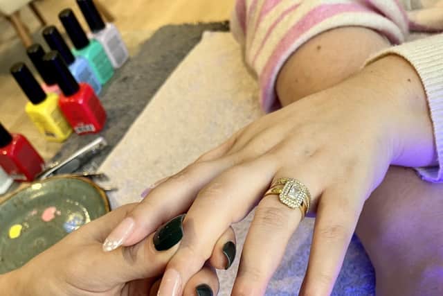“Use a brush tool and a dotting tool to create cherries. For an extra bit of glamour, add on statement gems before curing and securing the finished look.”