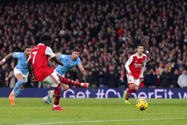 Erling Haaland wraps up win as Man City beat Arsenal to go top of ...