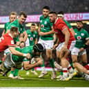 Caelan Doris of Ireland scores his side's first try despite the tackle of Liam Williams of Wales. (Picture: David Fitzgerald/Sportsfile)