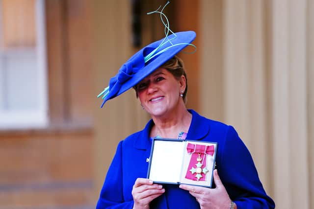 Opening a black box to reveal her sky blue cross and red-ribboned medal, she said: “It’s beautiful, isn’t it? I feel very fortunate to ride on the coat-tails of wonderful athletes.”