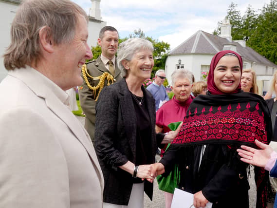 Catherine Connolly with guests at the Ara garden party