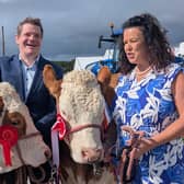 Peter Burke and Anna Marie McHugh with two cattle