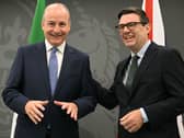Taoiseach Micheál Martin and Prime Minister Andy Burnham laughing together at No 10 North in Manchester
