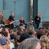 U2 during a performance in front of students from their old school in Dublin