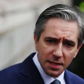 Headshot of Simon Harris speaking