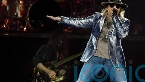 Axl Rose vows to stop throwing mic into the crowd following reported injury