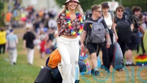 Initial bad weather does nothing to dampen spirits of Glastonbury festival-goers