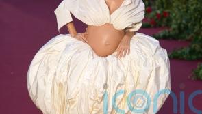 Sienna Miller bares baby bump at celebrity and royal-studded Vogue event