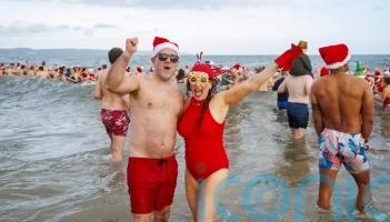 Hundreds brave the cold to make a splash for charity
