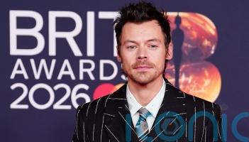 Florals, feathers and colour flashes on glittering Brits red carpet