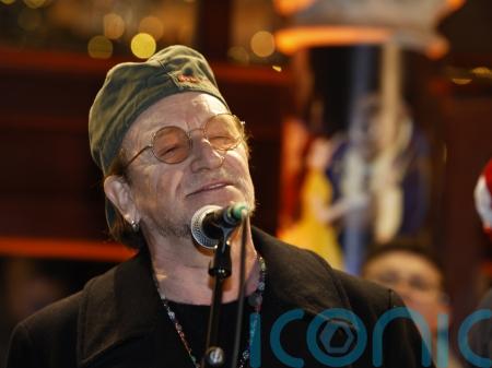 Bono joins annual Dublin city centre Christmas Eve busking session