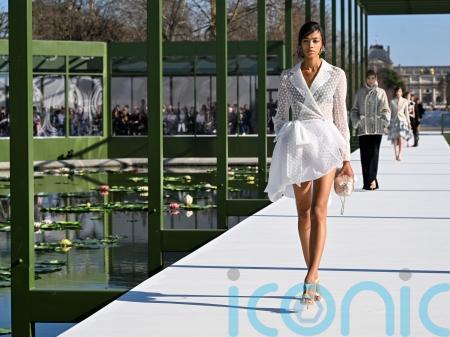 Dior blooms with peplums, bustles and waterlily florals in Paris Fashion Week show