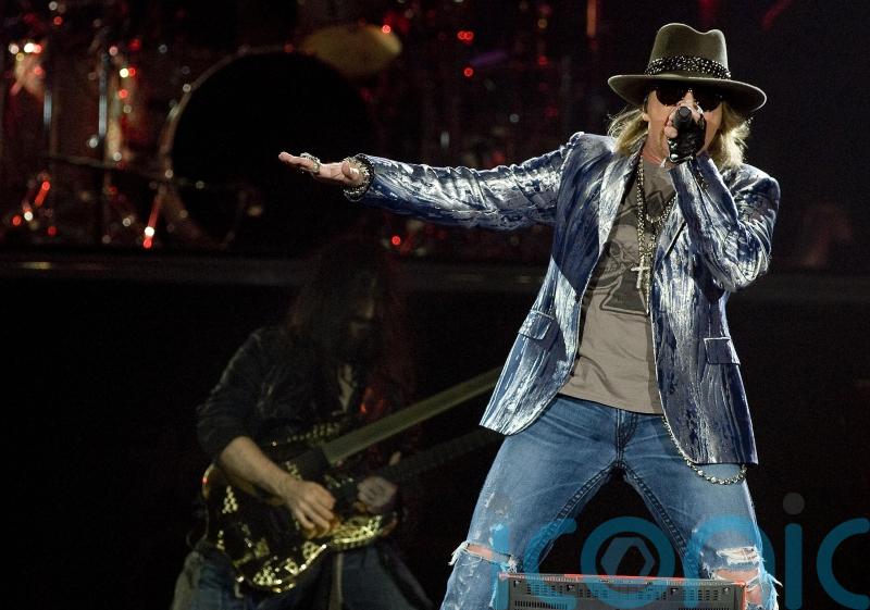 Axl Rose vows to stop throwing mic into the crowd following reported injury