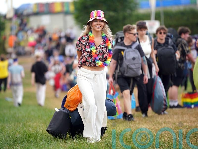 Initial bad weather does nothing to dampen spirits of Glastonbury festival-goers