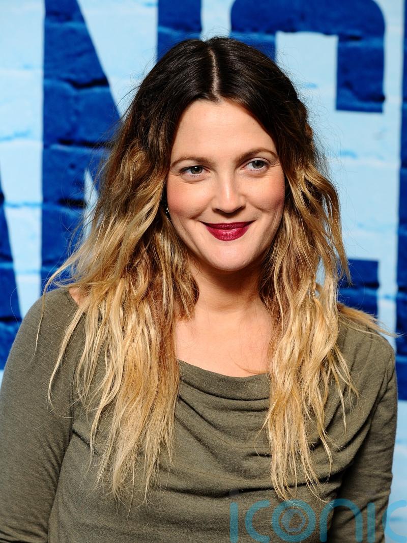Drew Barrymore escorted backstage at New York event after fan moves towards her