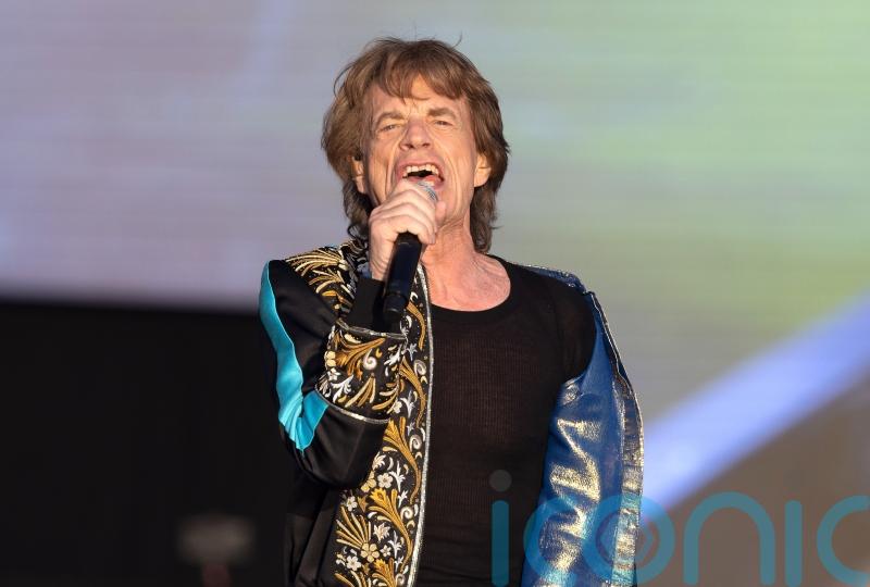 Mick Jagger wears a fake moustache and dresses as a nun in SNL skits