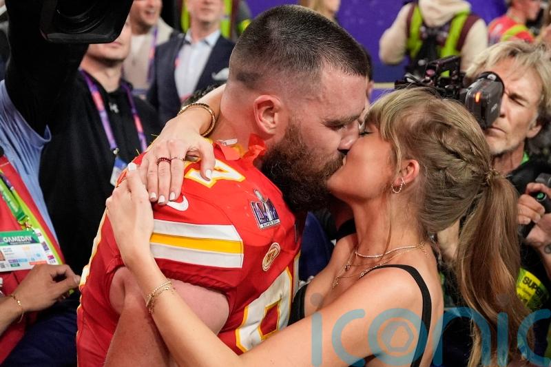 Taylor Swift and Travis Kelce seal Super Bowl victory with a kiss