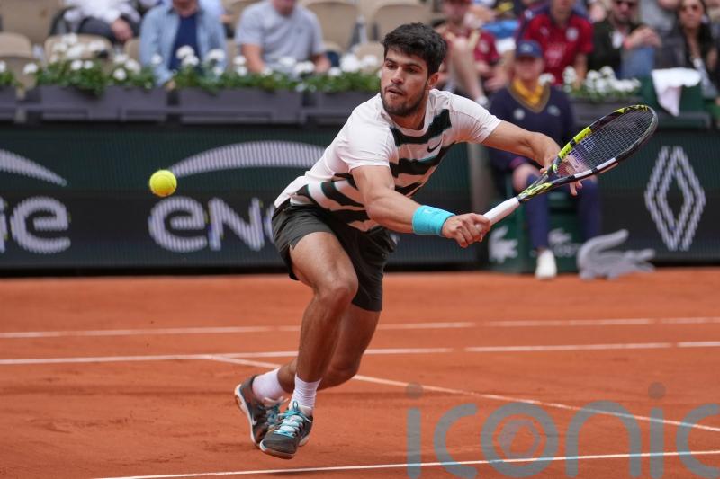 Carlos Alcaraz eases to straight-sets victory in French Open defence