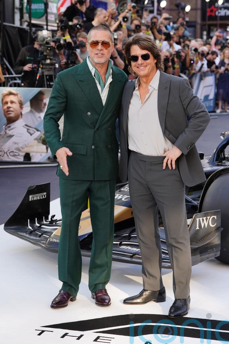 Brad Pitt embraces Tom Cruise at F1: The Movie premiere