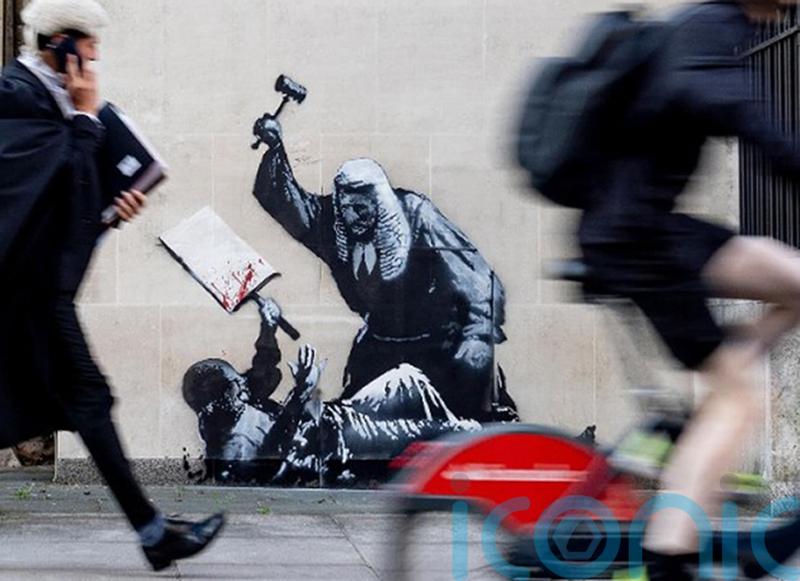 Concealed Banksy artwork shows judge beating unarmed protester