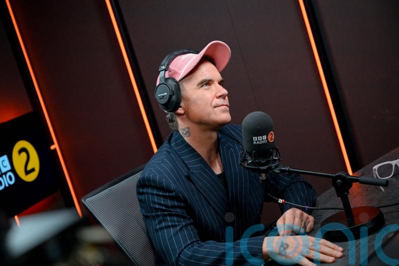 Robbie Williams says he will &lsquo;ride again&rsquo; with Take That and reveals new albums