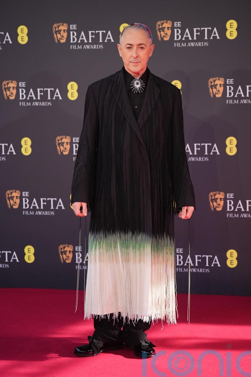 Stellan Skarsgard, Warwick Davis and Alan Cumming lead early Bafta arrivals