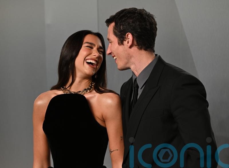 Dua Lipa and Callum Turner lead couples on red carpet at Vanity Fair Oscar Party