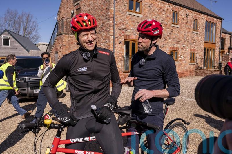 William praises Greg James as he joins him on cycle for Comic Relief